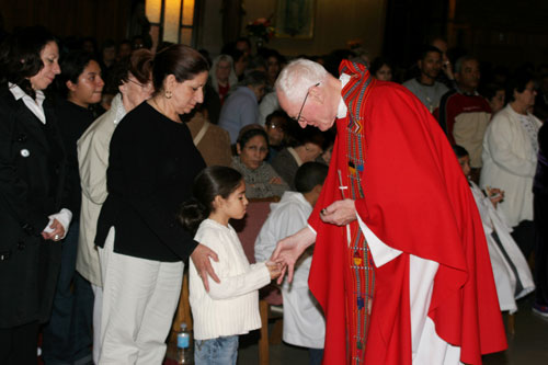 Fr. Mark Brummel blessing child